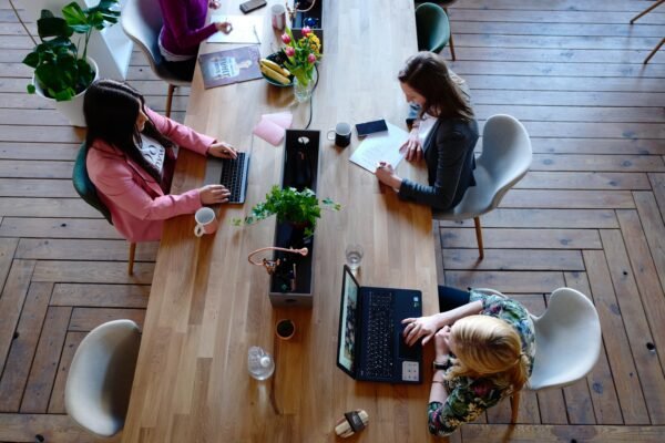 Photo by CoWomen: https://www.pexels.com/photo/three-woman-sitting-on-white-chair-in-front-of-table-2041627/