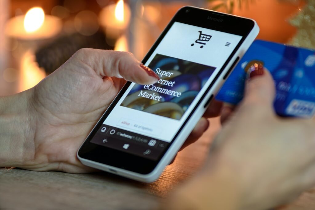 Photo by PhotoMIX Company: https://www.pexels.com/photo/person-using-black-and-white-smartphone-and-holding-blue-card-230544/